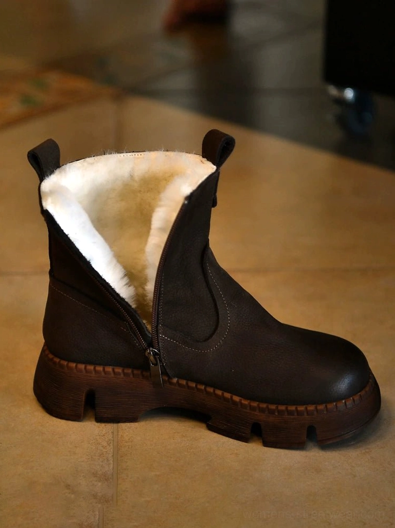 Dark Grey fur-lined winter boot with distressed leather finish, plush shearling interior, side zipper, pull tab, and rugged lug sole