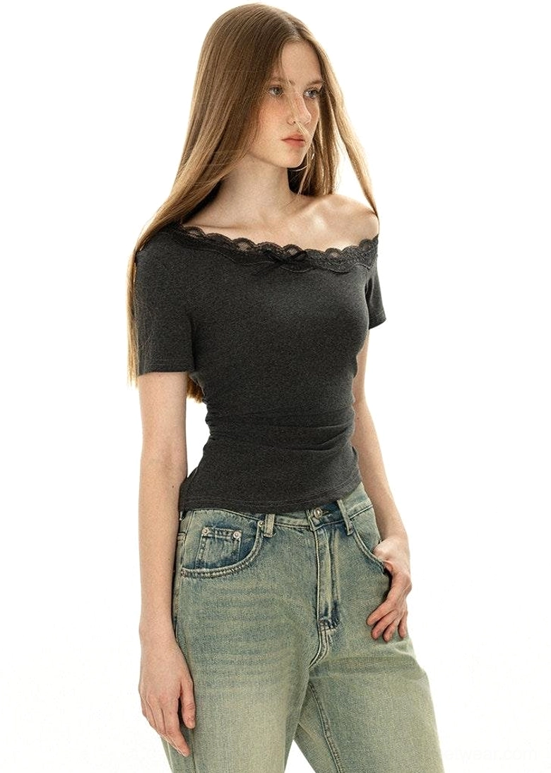 Dark grey Korean streetwear off-shoulder lace neckline top shown in a side three-quarter view