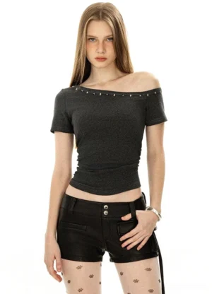 Dark grey studded one-shoulder crop top in fitted Y2K rock streetwear style front view