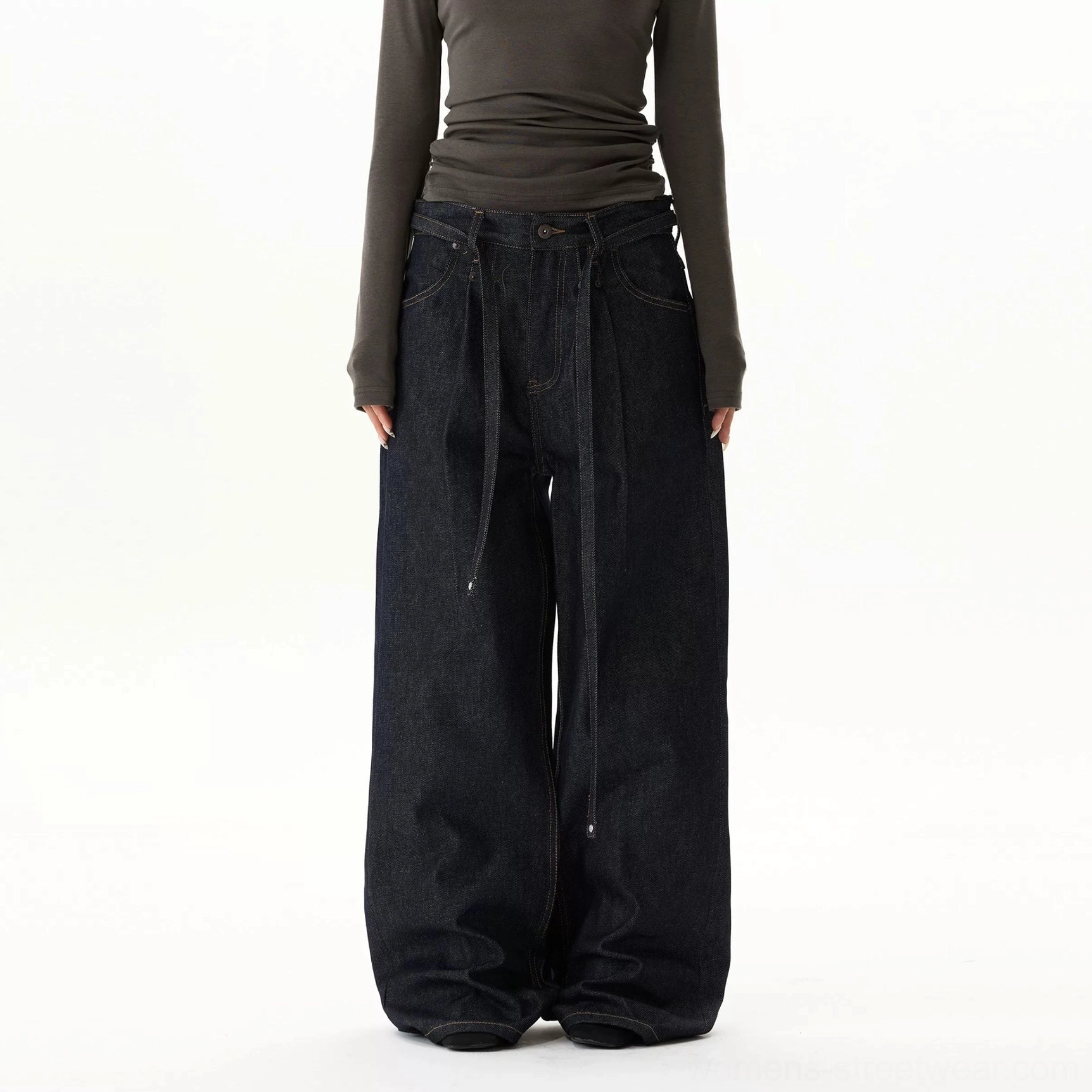 Full product view of dark indigo oversized balloon jeans with ultra-wide legs, tie waistband, pleated front, and extra-long puddle hems