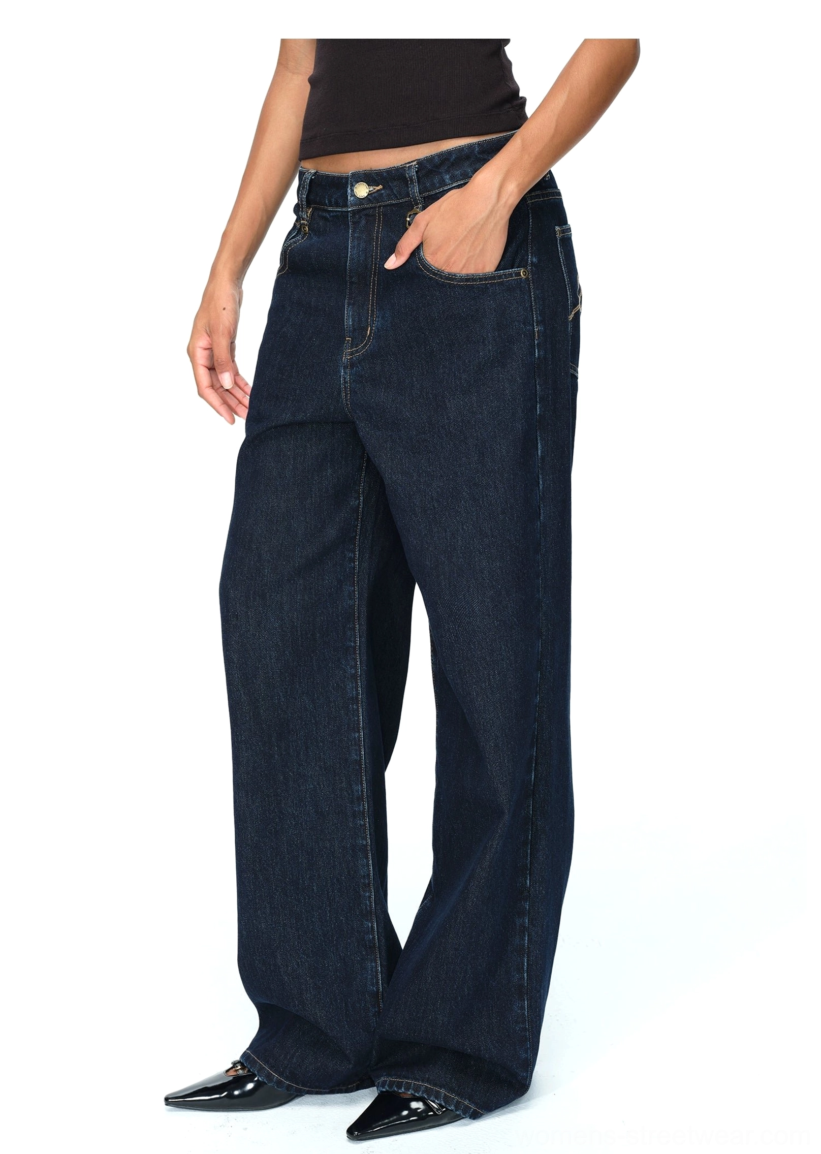 Dark indigo raw denim trousers with wide legs and utility-inspired details for modern streetwear wardrobes