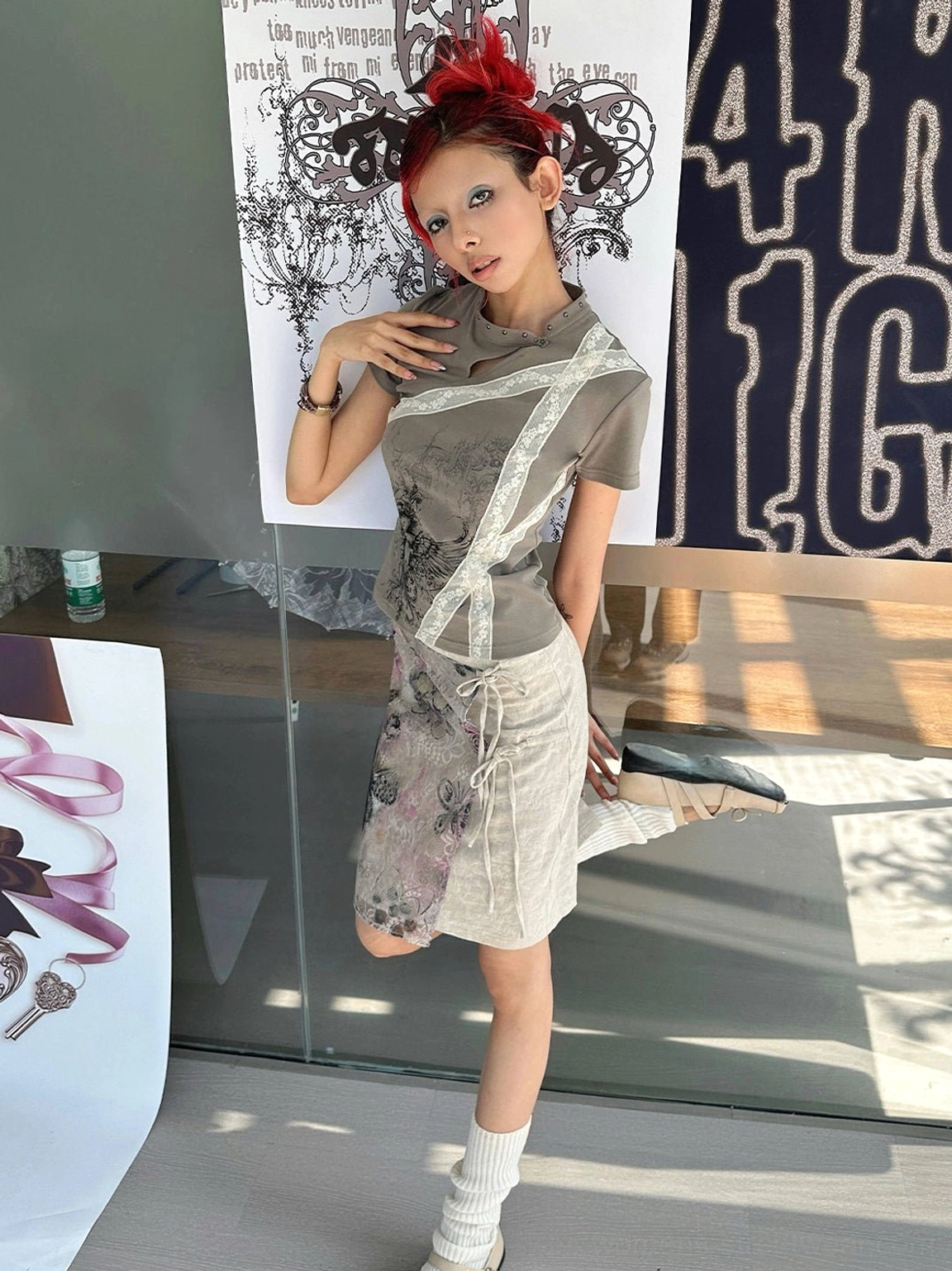 Dark khaki graphic slim fit tee with cheongsam collar and diagonal white lace trim styled indoors
