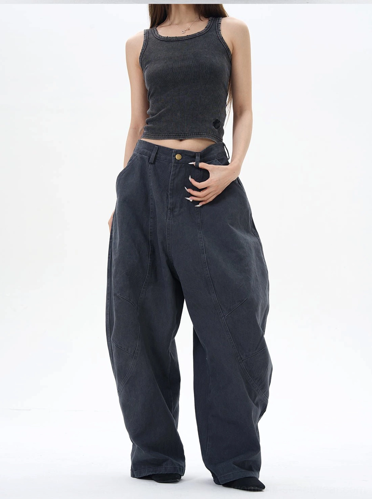Dark washed navy wide-leg cargo pants with oversized baggy silhouette and button fly streetwear styling