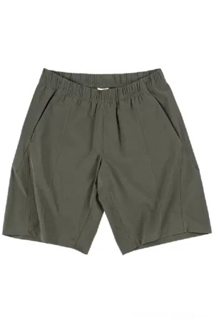 Front flat lay of dark olive green quick-dry tech shorts with elastic waistband, angled pockets, and tailored center seam