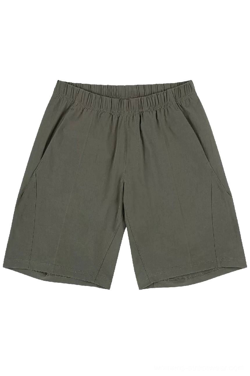 Front flat lay of dark olive green quick-dry tech shorts featuring the relaxed unisex cut and structured utility details