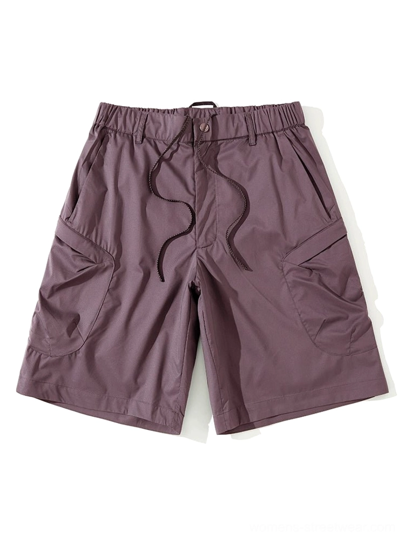 Dark purple cargo shorts flat lay with adjustable drawstring waist, oversized side pockets, and water-repellent fabric