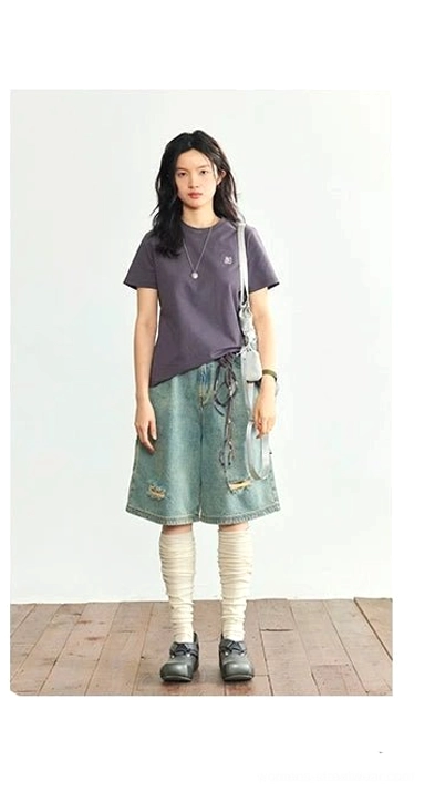 Dark purple minimalist embroidered logo crew neck t-shirt full body front view ripped shorts tall socks