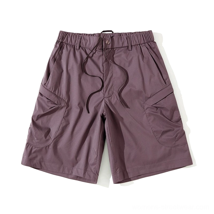 Dark red breathable cargo shorts with water-repellent fabric, oversized pockets, and bold contemporary streetwear color