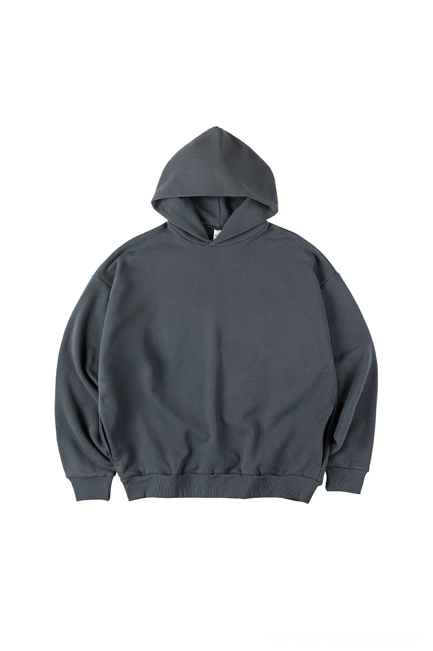 Dark slate gray oversized streetwear hoodie shown with hood up dropped shoulders ribbed hem and comfortable pullover fit