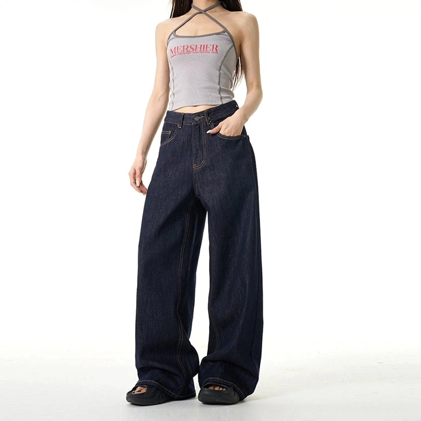 Female model wearing dark wash mid-rise wide-leg jeans with a gray printed halter top and open-toe shoes for a modern Korean streetwear look
