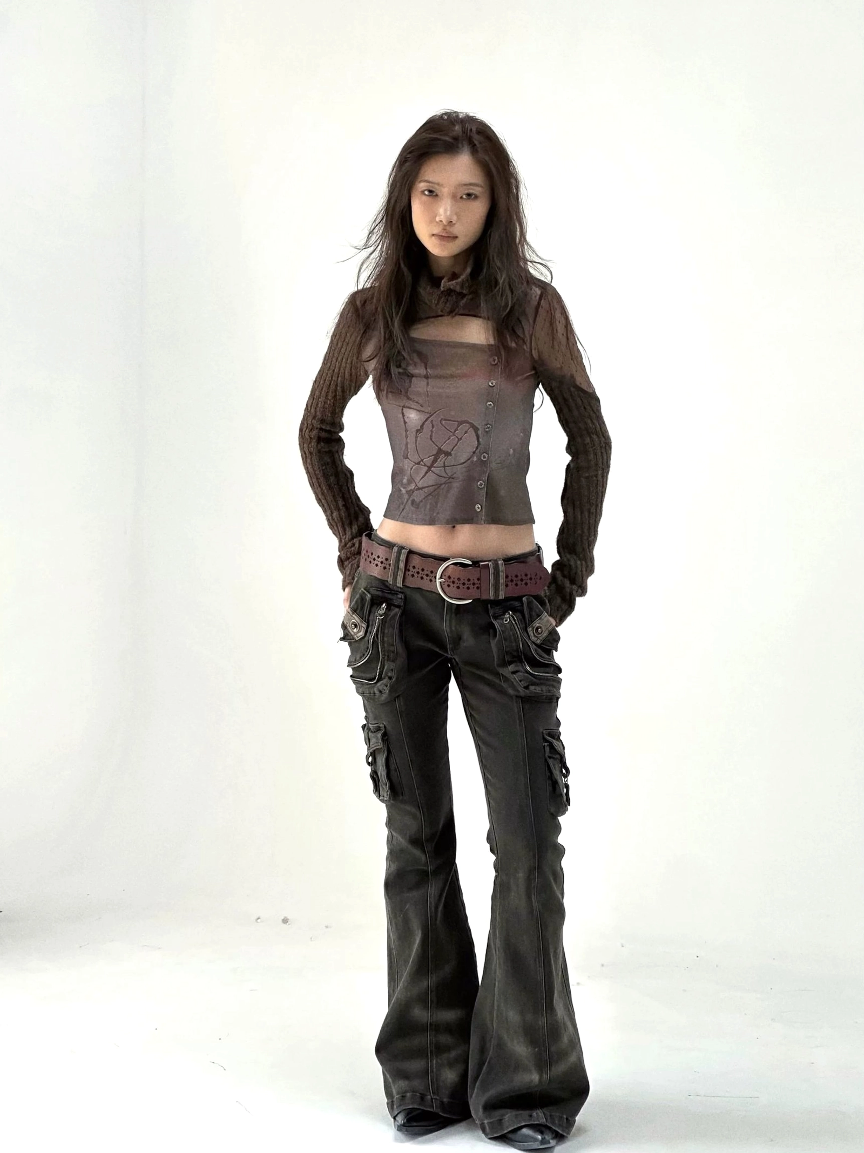 Dark washed cargo flare denim jeans designed with a fitted hip, elongated leg line, oversized pockets, and vintage streetwear character