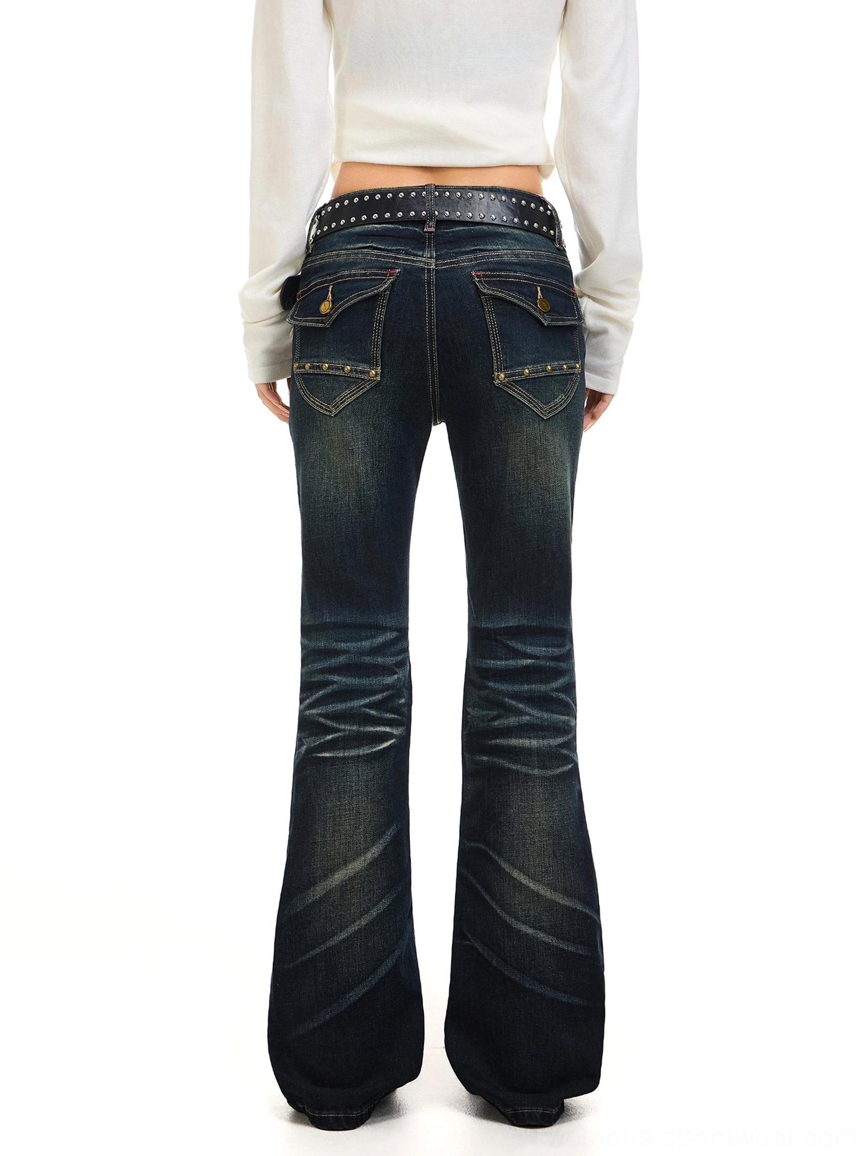 Rear view of dark washed flared denim jeans showing flap back pockets, contrast stitching, and wide bell-bottom hems