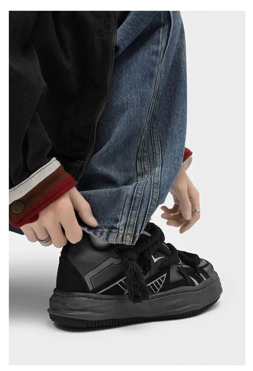 Deconstructed streetwear chunky sneakers with oversized tassel rope laces, contrasting upper panels, distressed rubber sole, and casual everyday styling