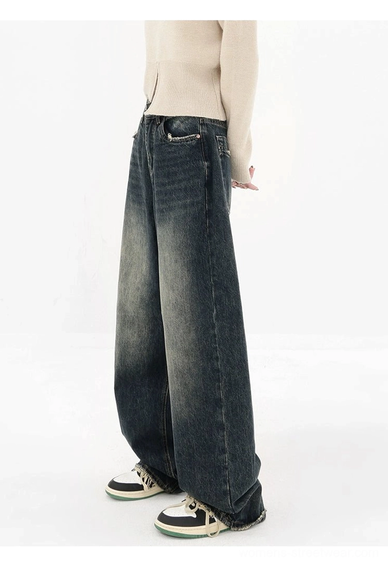Deep blue high-waisted wide-leg jeans side front view with faded wash loose fit and classic front pocket