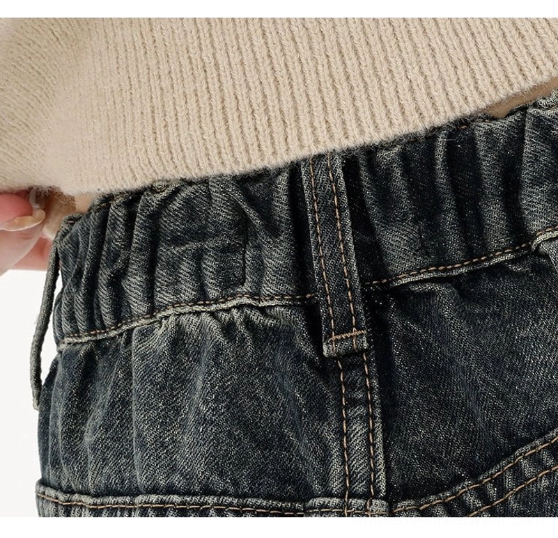 Deep blue wide-leg jeans with elastic back waist and frayed raw hem detail