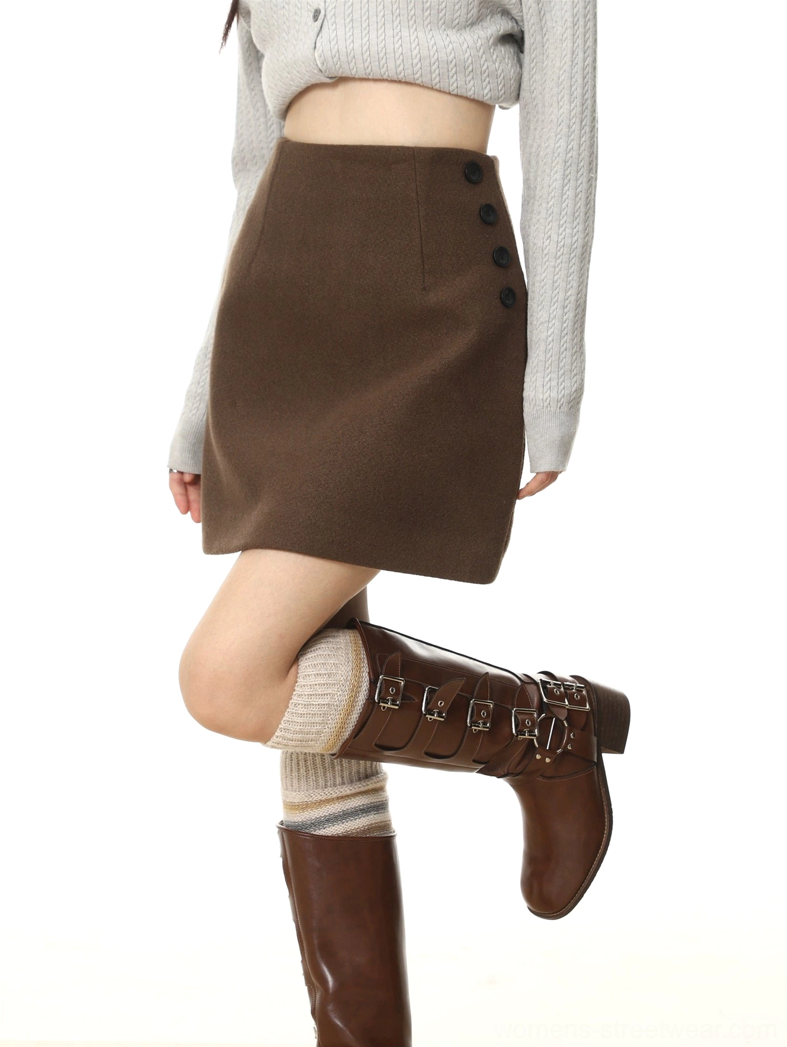 Deep brown high-waisted wool-textured A-line mini skirt with four black side buttons styled with a cropped gray top and knee-high boots