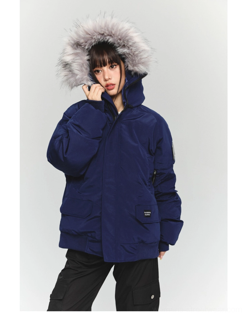 Front medium close-up of a deep navy oversized faux fur parka with ribbed cuffs front pocket label and relaxed gorpcore silhouette
