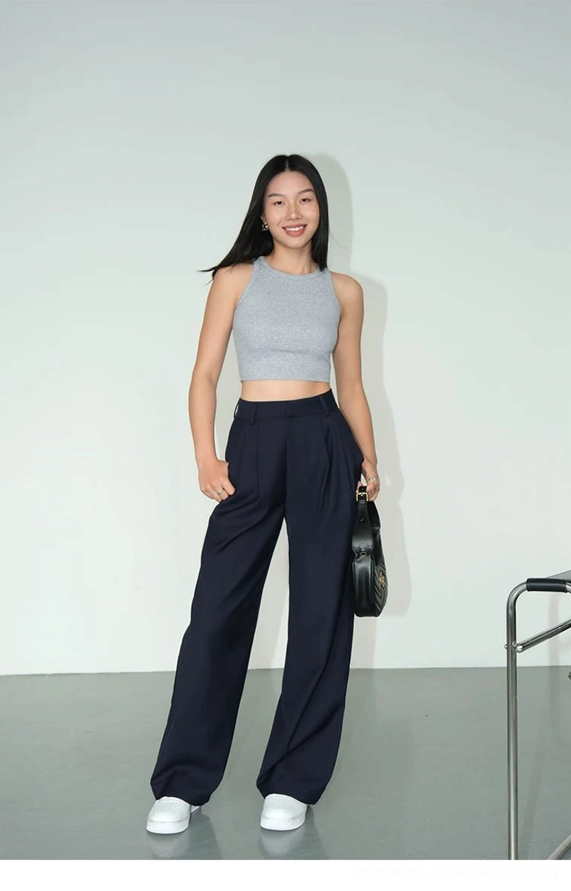Deep navy classic wide-leg tailored streetwear pants with soft drape fabric shown in a full outfit