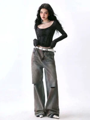 Black deep U-neck corset print long sleeve base layer top styled with ripped wide-leg jeans and a white belt
