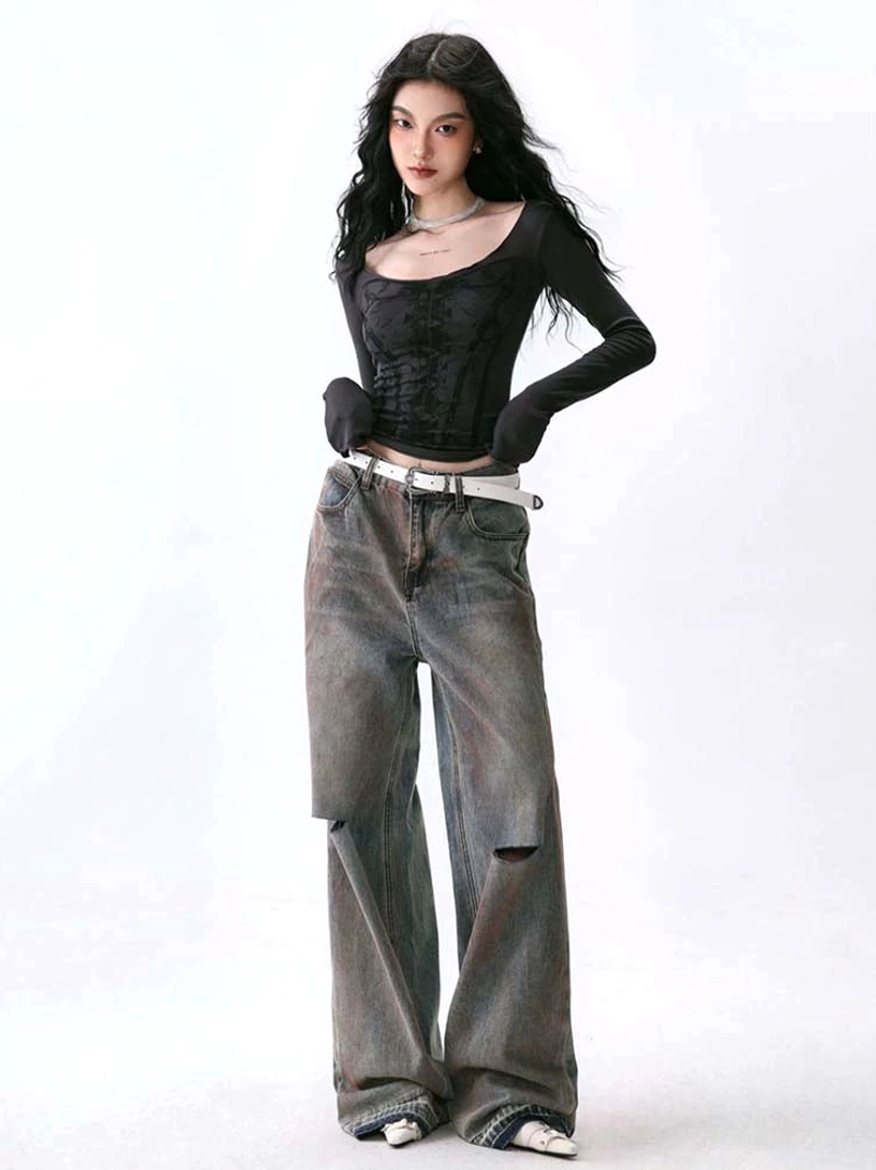 Black deep U-neck corset print long sleeve base layer top styled with ripped wide-leg jeans and a white belt