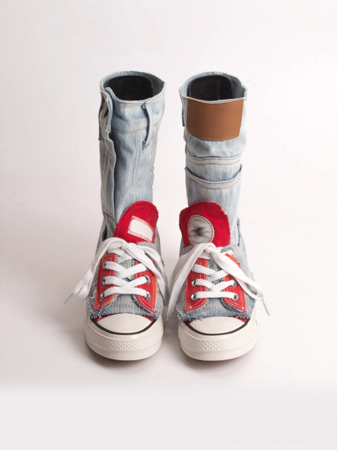 Front product view of matching light blue denim fold-cuff high-top platform sneakers with folded brown cuffs and red star patches