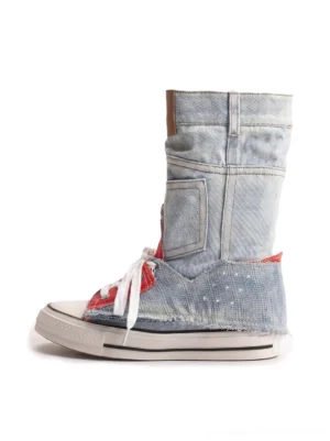 Side view of light wash blue denim fold-cuff high-top platform sneakers with frayed edges, brown cuff tab, white laces, and raised rubber outsole