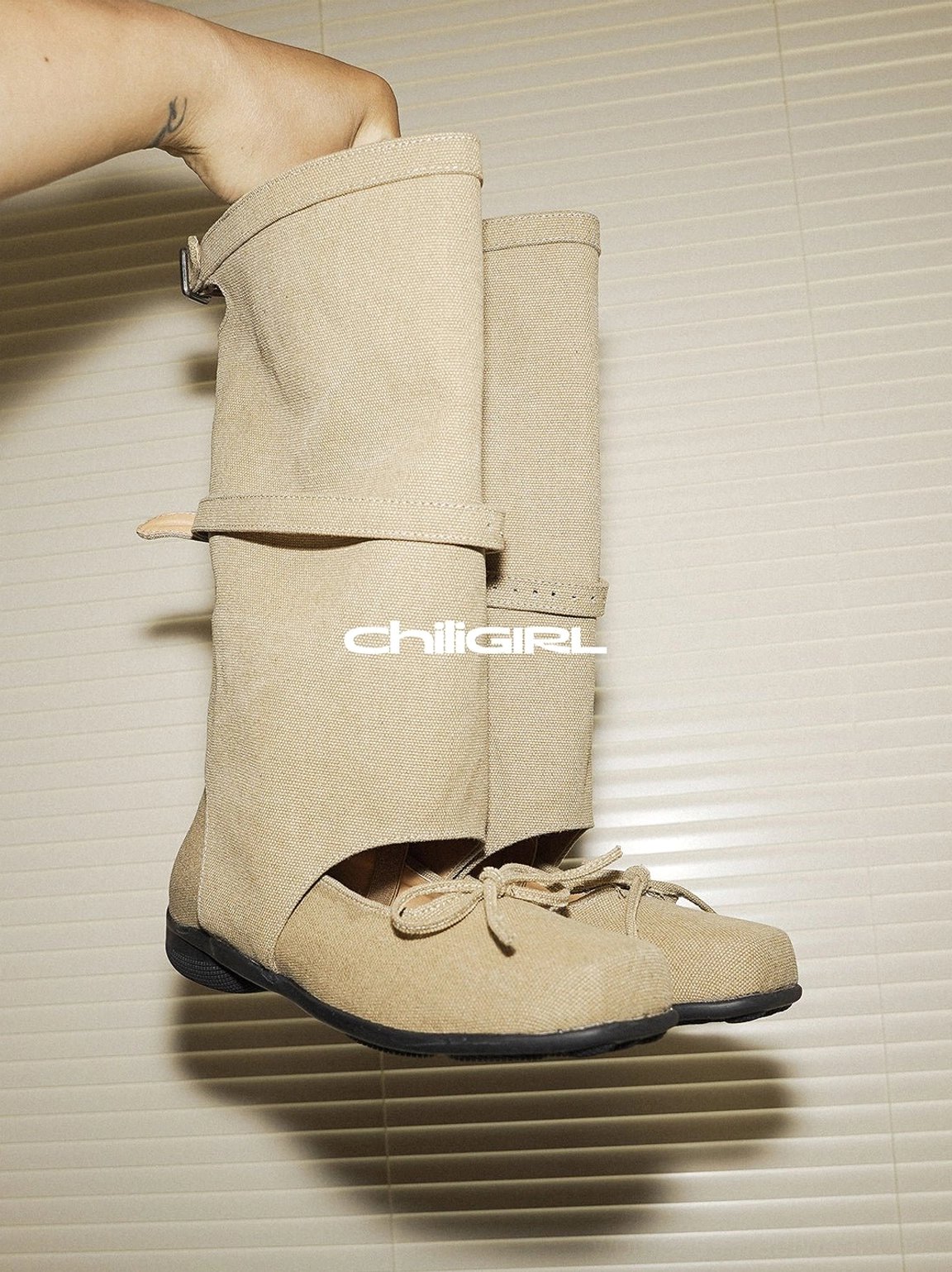 Fashion-forward denim sandal boots combining Mary Jane straps, a tall shaft and ballet-inspired bow detail