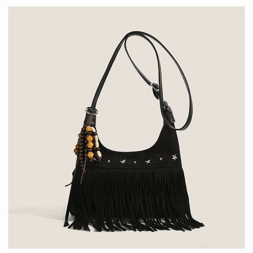 Black faux suede desert star fringe hobo shoulder bag with silver star studs and beaded pendant front view
