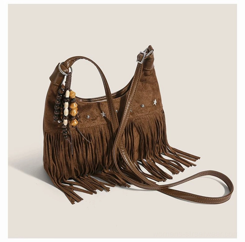 Brown faux suede fringe hobo shoulder bag with long tassels silver star studs and detachable strap top view