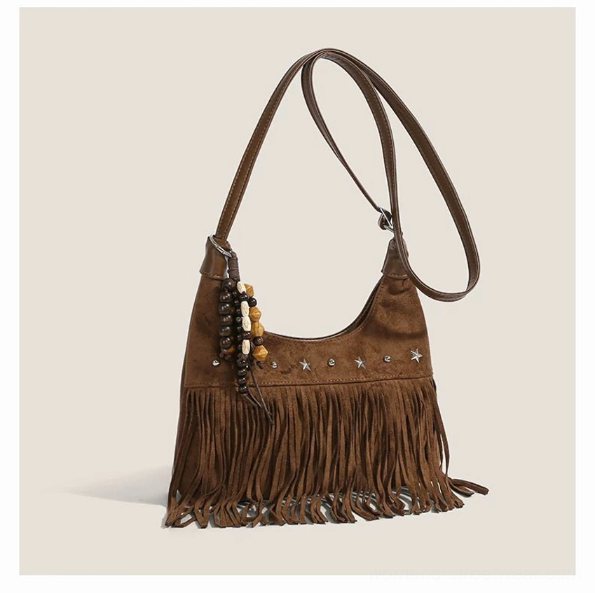 Brown faux suede desert star fringe hobo shoulder bag with silver star studs and beaded pendant front view