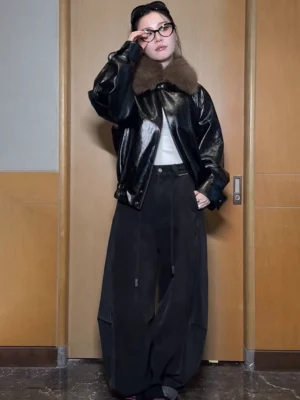 Black balloon leg streetwear denim pants with layered plaid waist detail styled with a fur-trim bomber jacket