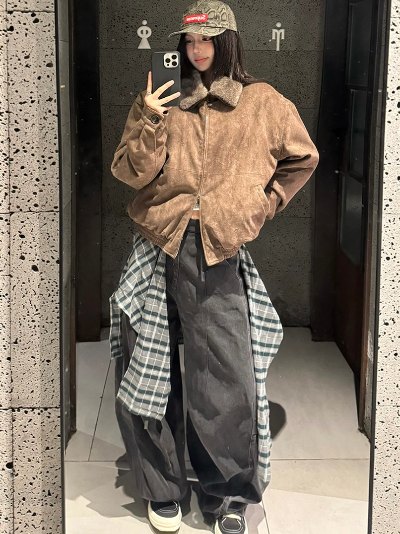 Layered plaid balloon leg denim pants styled with a cropped shearling collar jacket in an indoor mirror outfit view