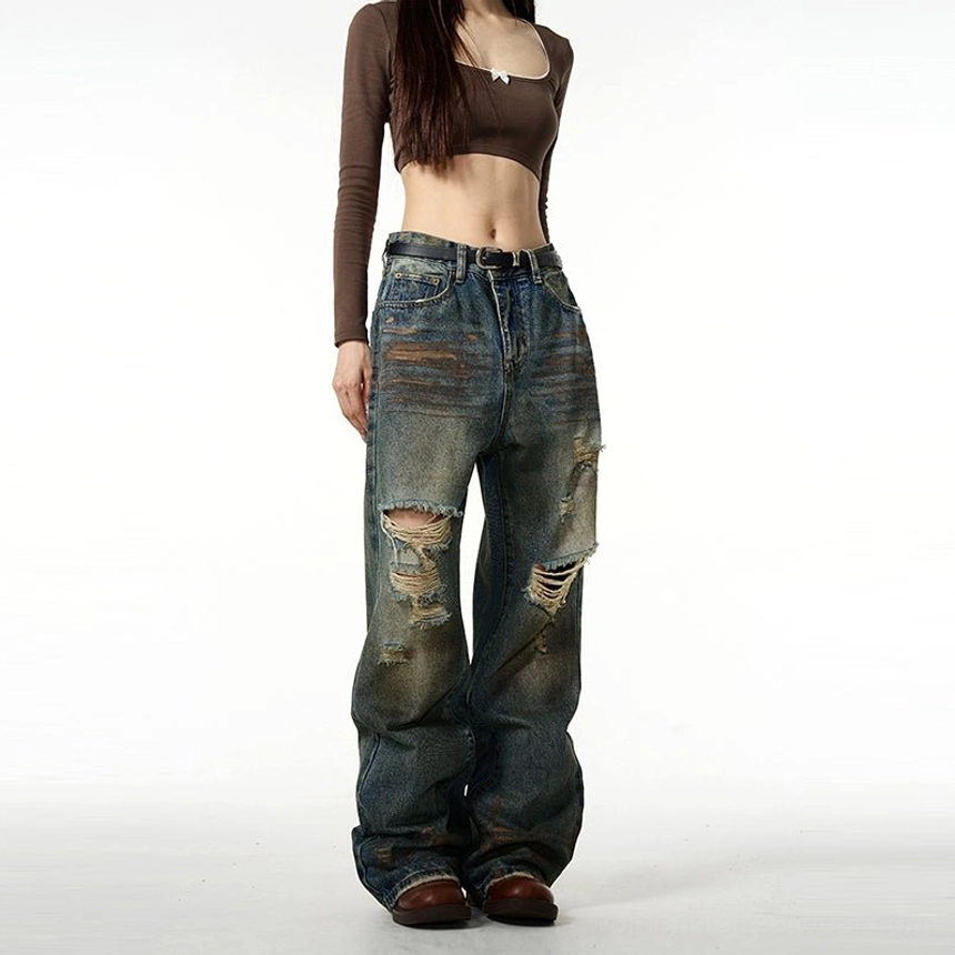 Contemporary distressed baggy jeans in vintage blue denim for Korean fashion, Acubi style, and everyday streetwear looks