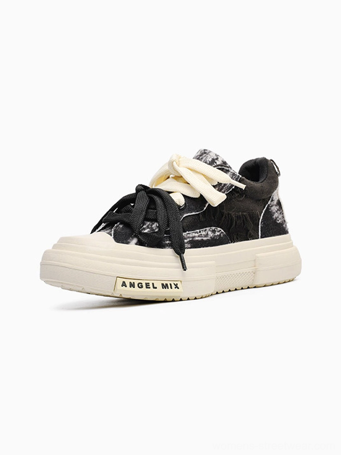 Distressed black canvas platform sneakers featuring a clean unisex low top shape and textured streetwear finish