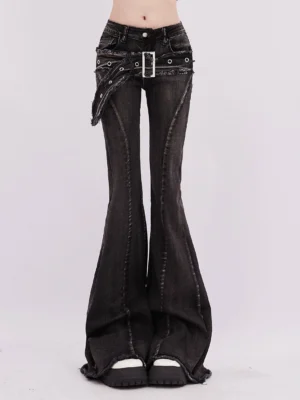 Close-up front view of distressed black gray wash flared denim jeans with detachable buckle belt, vertical seam details and raw frayed hems