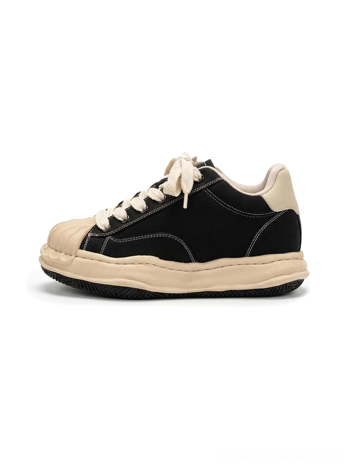 Black distressed platform court sneakers with cream shell toe, frayed contrast panels, and thick 7cm height-boosting sole shown from the left side