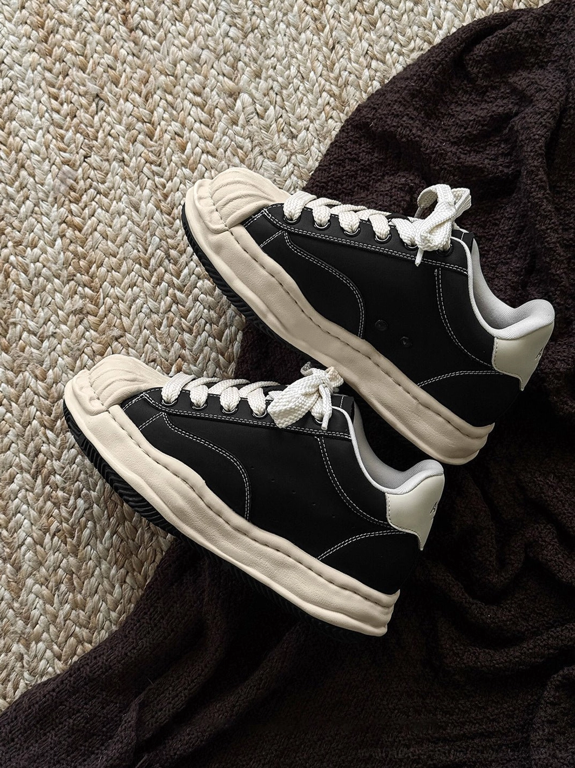 Distressed black platform court sneakers with cream shell toe and 7cm sculpted sole product detail