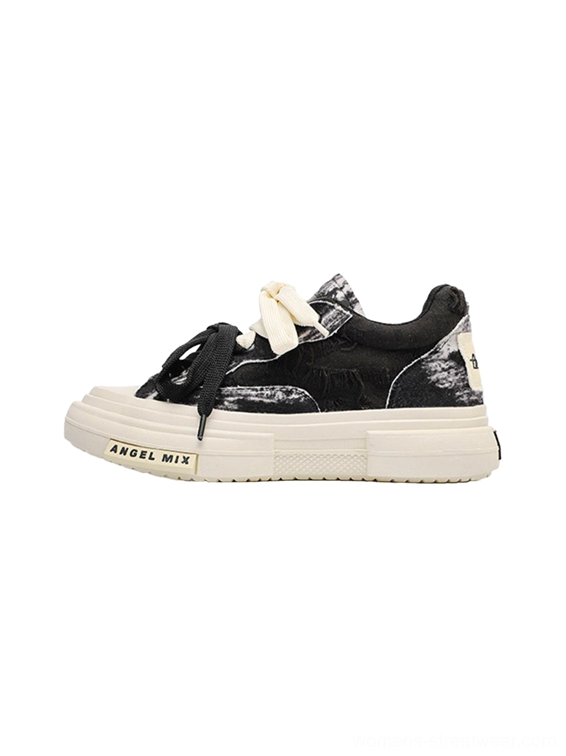 Black and white distressed tie dye canvas platform sneakers shown in a side view with a thick white sole and streetwear low top silhouette