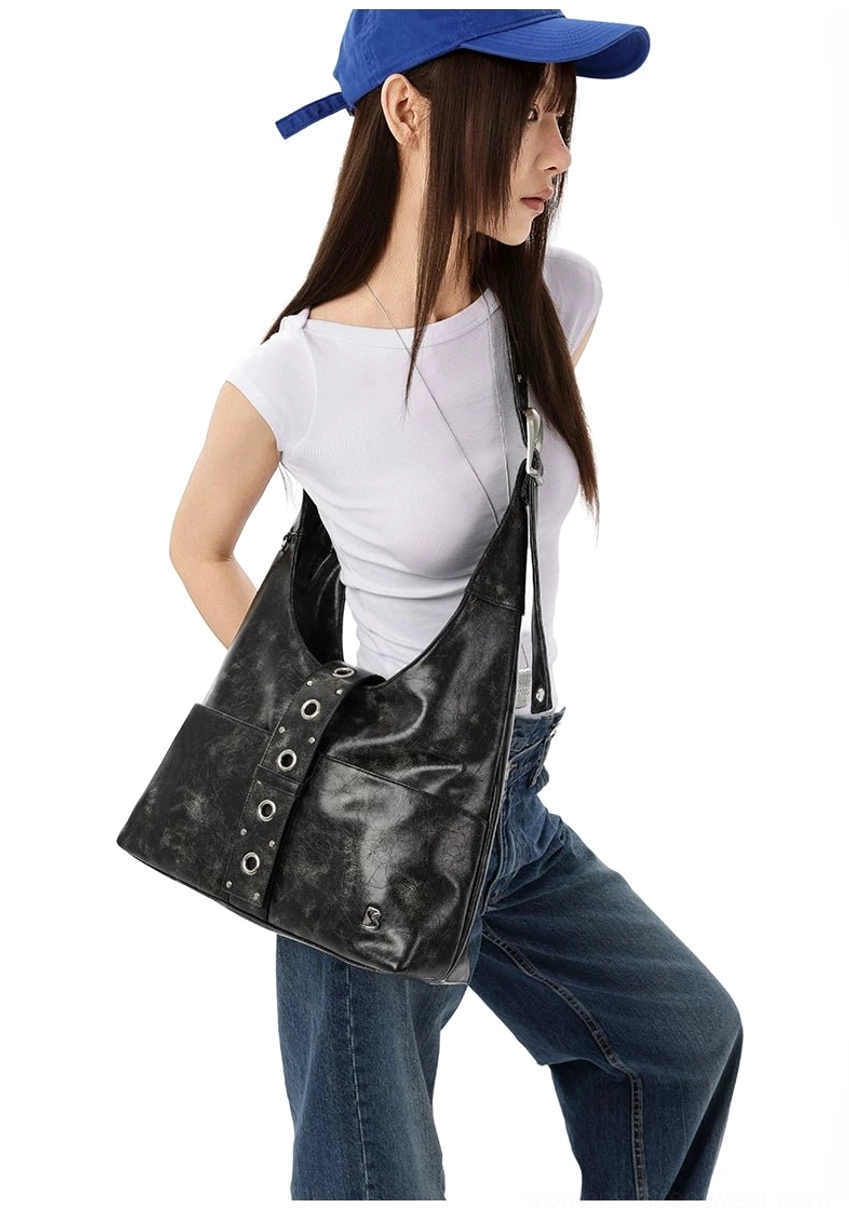 Right side profile of distressed black Y2K hobo shoulder bag with slim adjustable strap