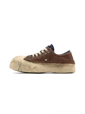 Brown and blue colorblock distressed platform sneakers with cracked off-white sole and casual low-top streetwear design