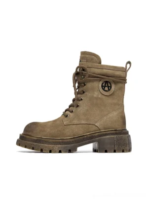 Brown distressed platform combat boots side view flat lay on white background showing suede texture AA logo ankle patch and thick lug sole
