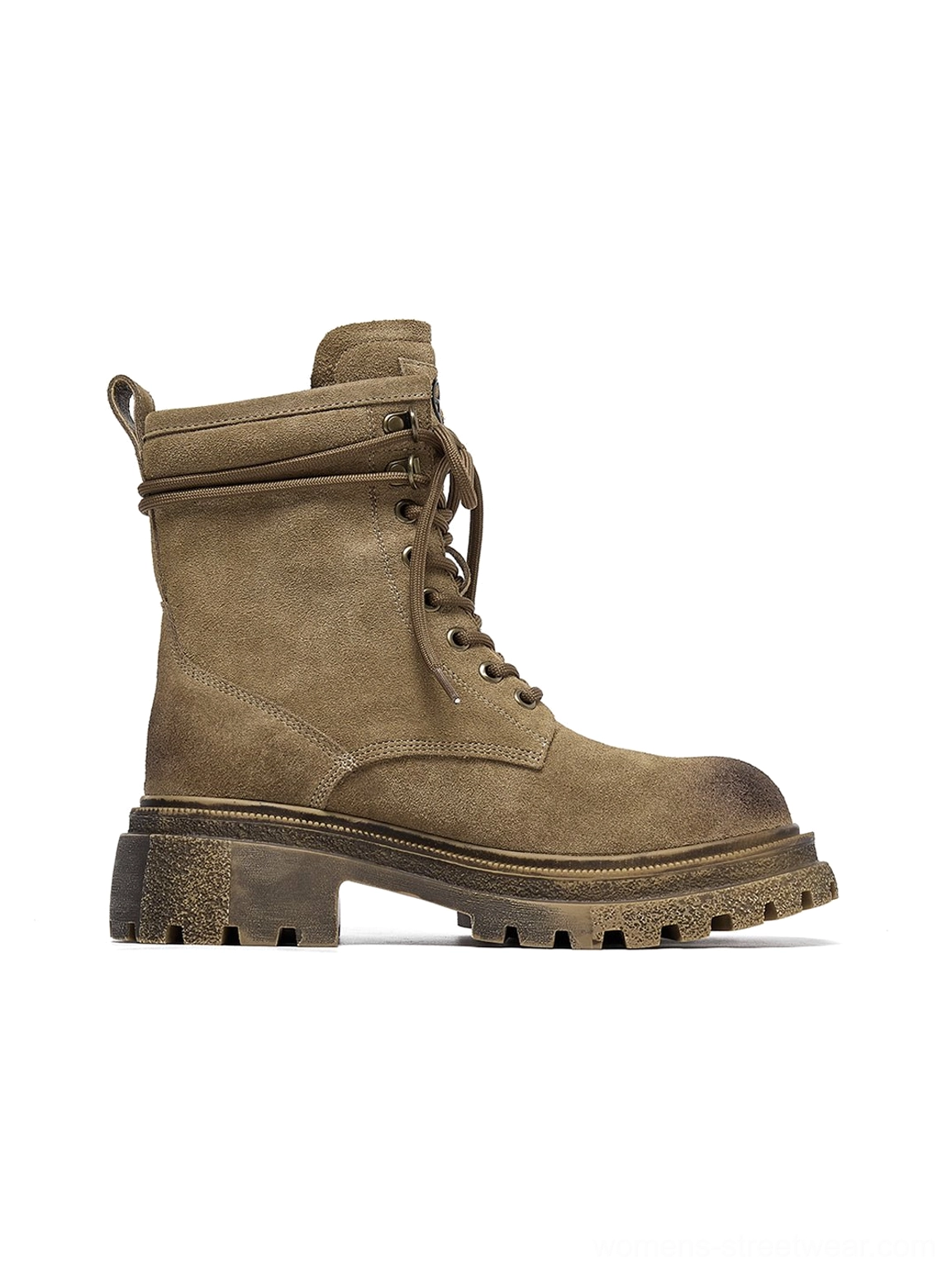 Brown distressed combat boots worn on feet showing platform height elevation street style urban aesthetic on-foot appearance