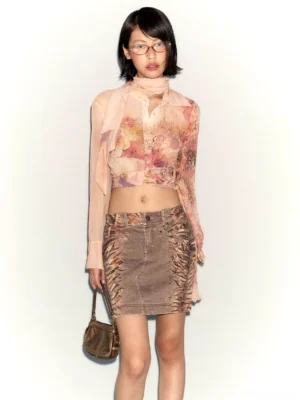 Front full-body view of distressed brown sheer floral scarf blouse and denim mini skirt set with cropped silhouette