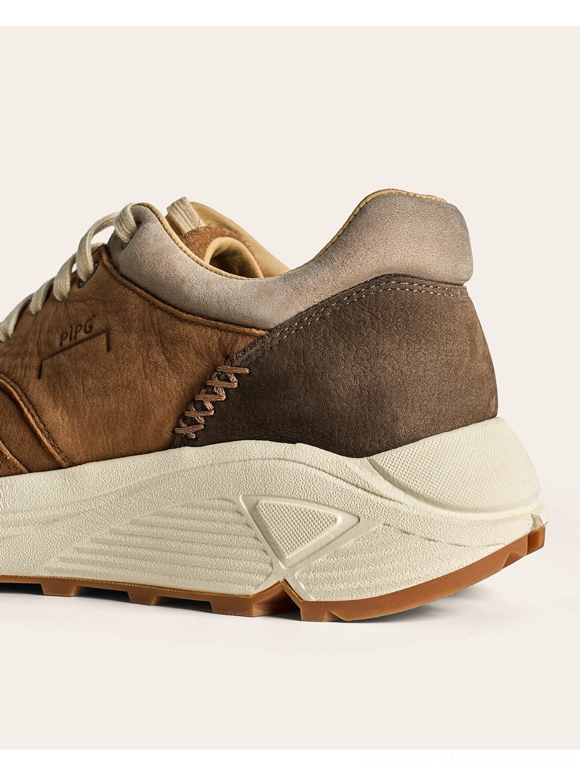 Distressed brown trail runner sneakers with tactile suede panels and versatile everyday streetwear design