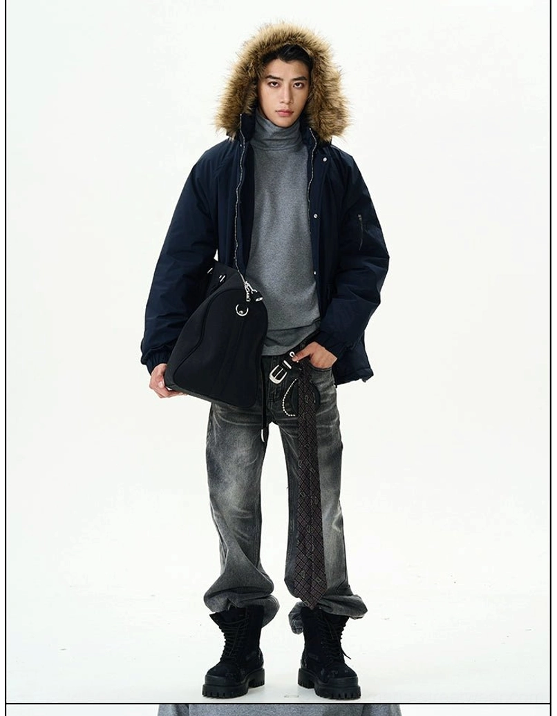 Charcoal distressed washed straight leg jeans styled with a textured jacket boots belt and shoulder bag