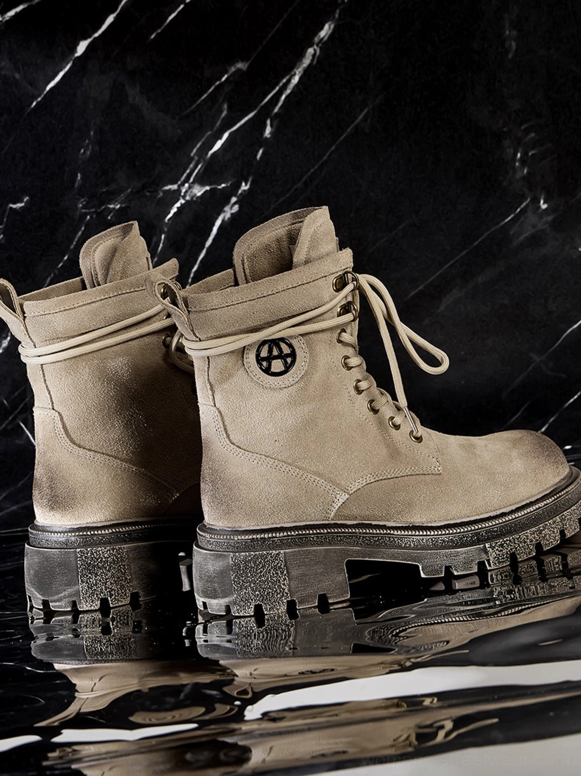 Distressed platform combat boots sole close-up showing heavy lug traction pattern anti-slip grip outsole engineering