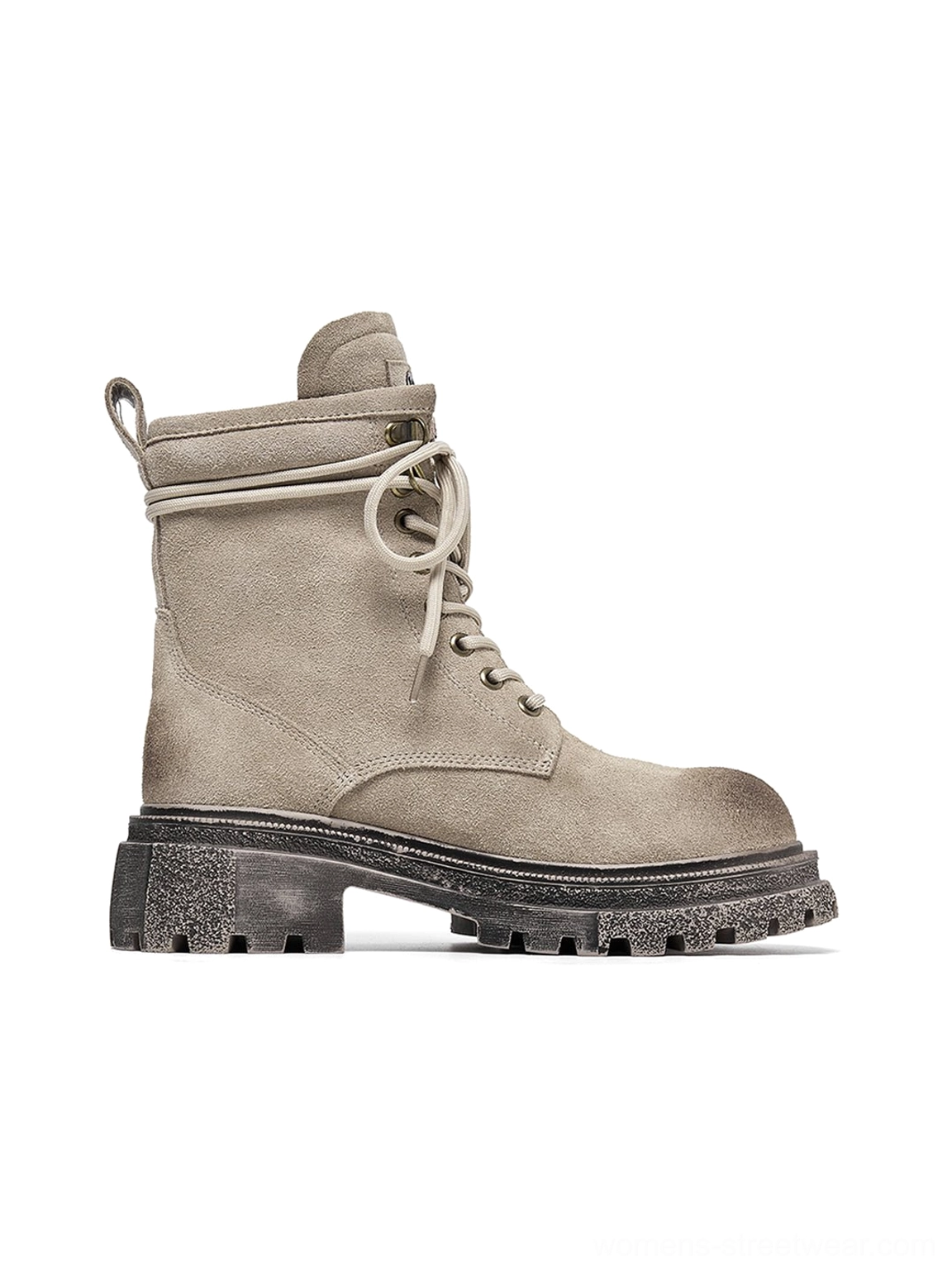 Distressed combat boots styled with techwear outfit showing oversized proportions functionality aesthetic modern streetwear