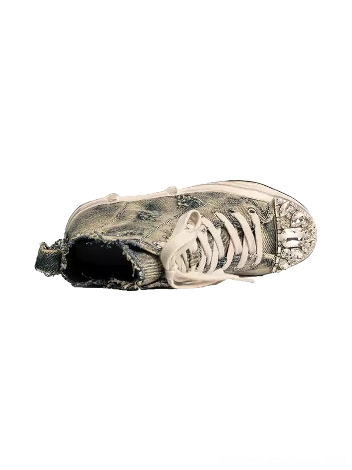 Top-down view of a distressed denim high-top sneaker with visible lace holes, full lacing system, frayed denim edges, and sparkling rhinestone toe cap