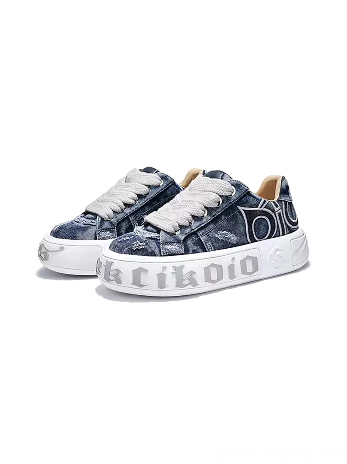 Front three-quarter view of matching distressed denim platform skate sneakers with chunky white soles