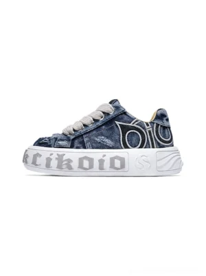 Side view of distressed blue denim platform skate sneakers with chunky white sole and classic lace-up streetwear design